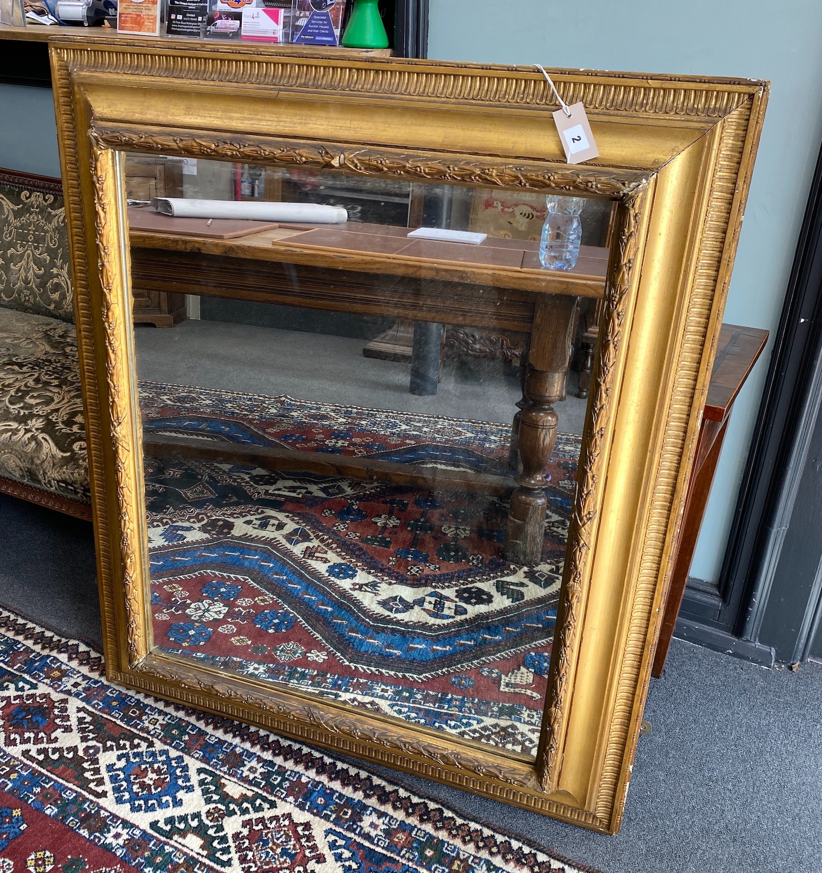 A 19th century rectangular giltwood and composition wall mirror with later plate, width 95cm, height 110cm